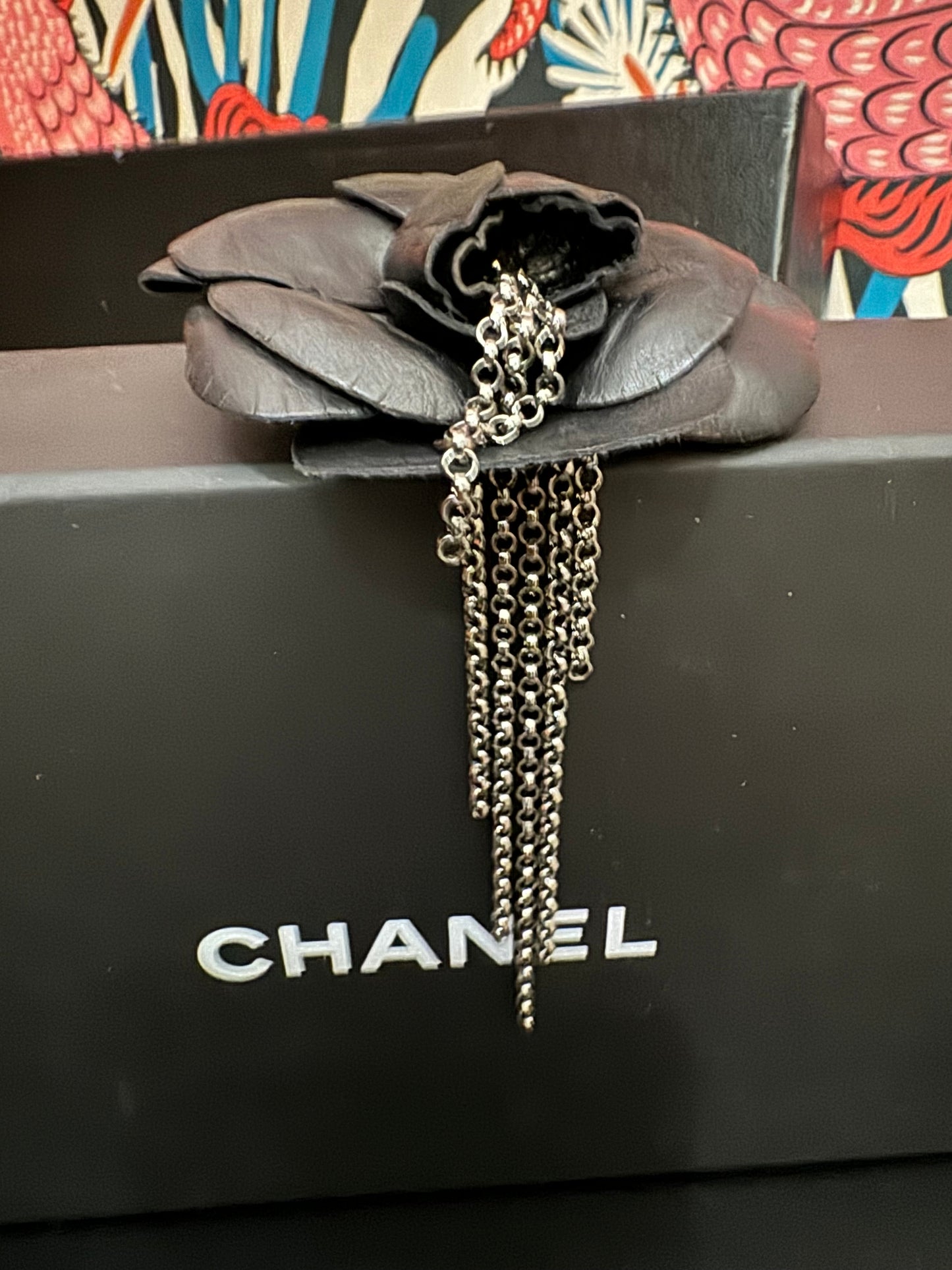 Authentic Chanel Lambskin Brooch with Chain Detail.