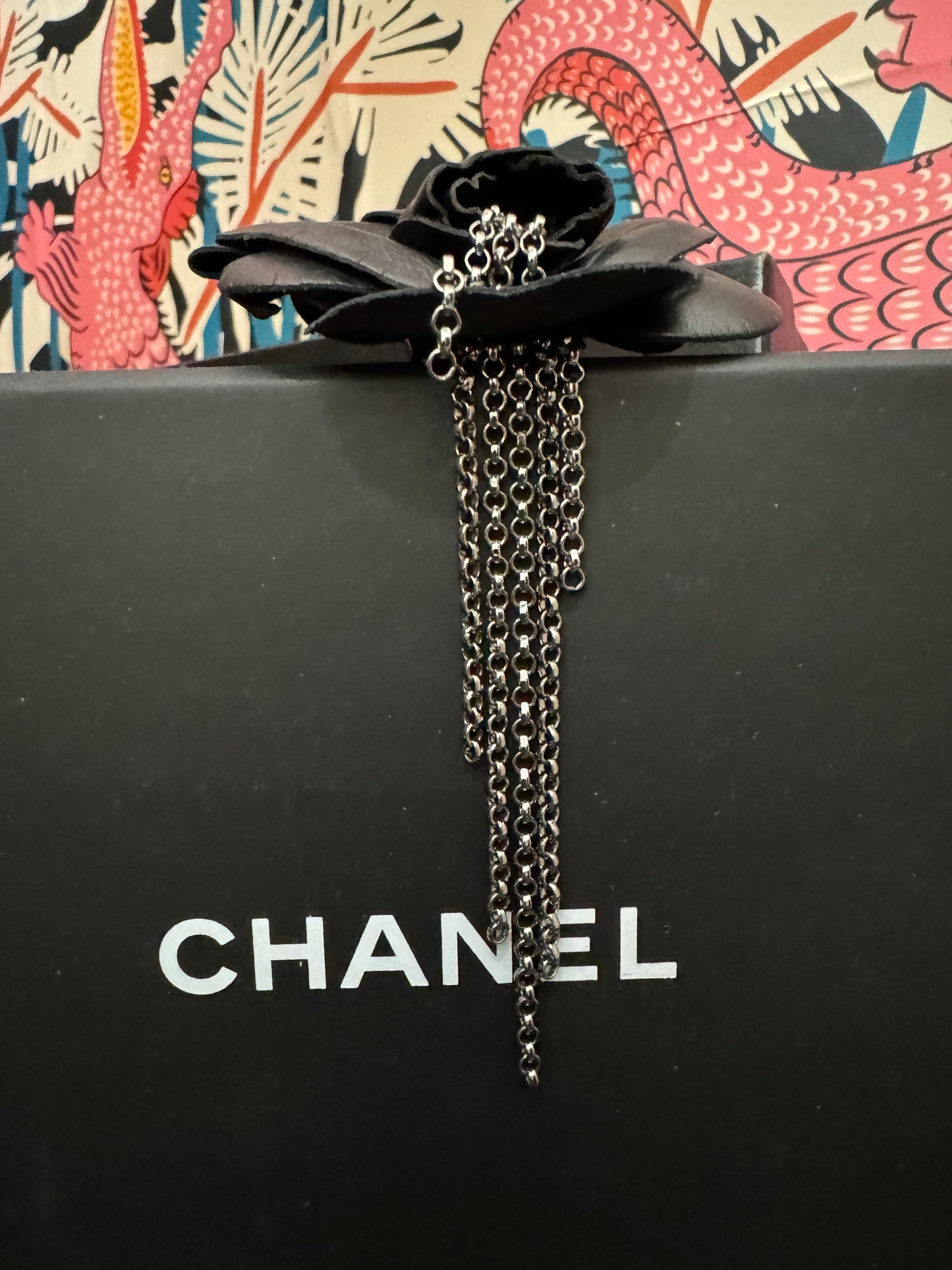 Authentic Chanel Lambskin Brooch with Chain Detail.